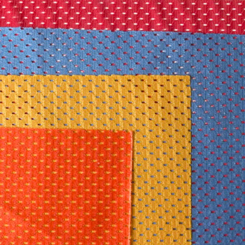4 swatches of different colored fabric atop each other